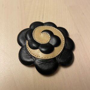 Chanel Camelia Corsage brooch in black and tan leather
